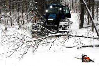 Mazinaw Powerline Groomers remove fallen branches from trail near Cloyne